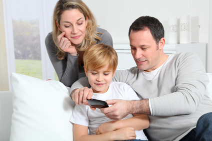 Family playing video game on smartphone